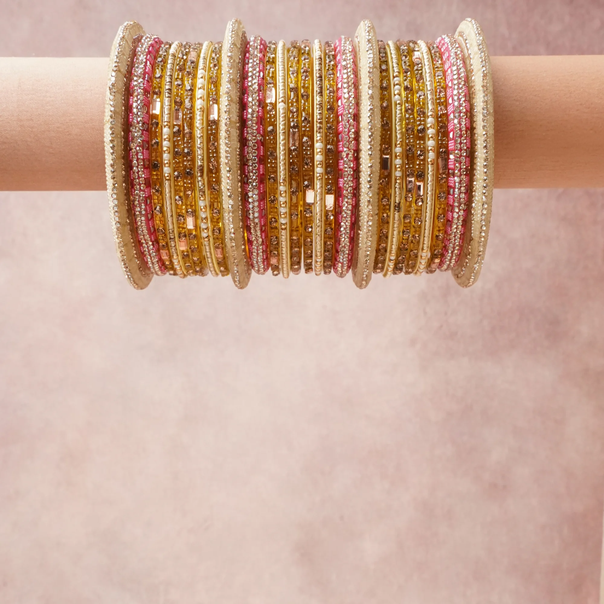 A grounding Cream forms the heart of the set, while touches of Fuchsia, Clear Crystal, Pale Yellow, Gold add charm.

A thoughtful composition of Fabric, Gold-toned Metal, Glass, Rhinestone, Beads, designed to feel complete without being heavy.
Each element layers seamlessly, creating a look that is refined, wearable and quietly striking.